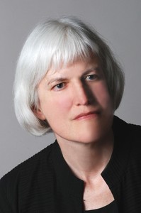Picture shows Kleege, slightly tilted to the left and slightly facing right. She has silver hair worn in bangs and cut to just below her ears. She wears a black, collarless shirt. [end of description]